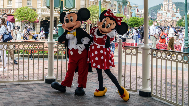Minnie and Mickey Mouse greeting guests