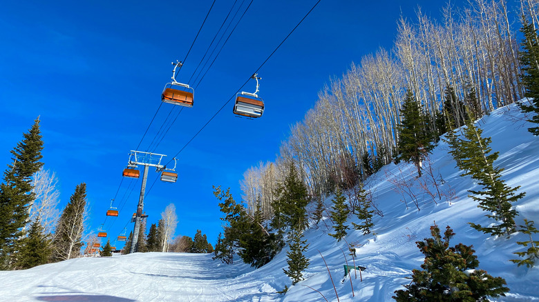 Snow covered mountain and chair lift