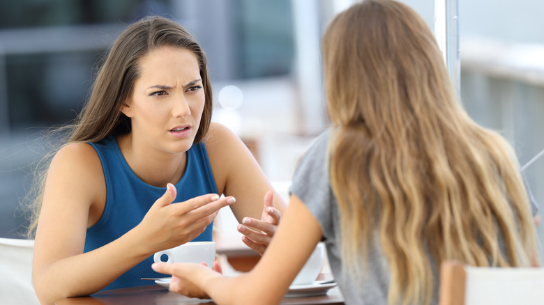 woman getting frustrated in conversation