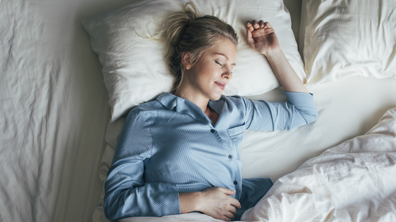 woman comfortable in hotel bed