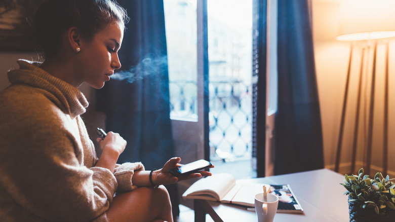 woman smoking in hotel