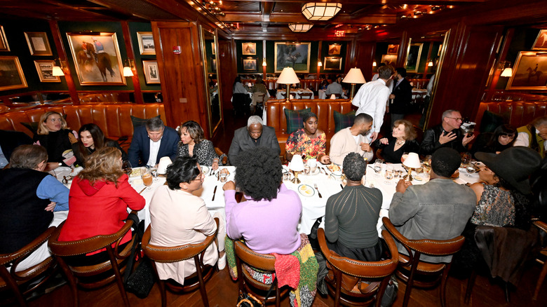 People eating inside The Polo Bar