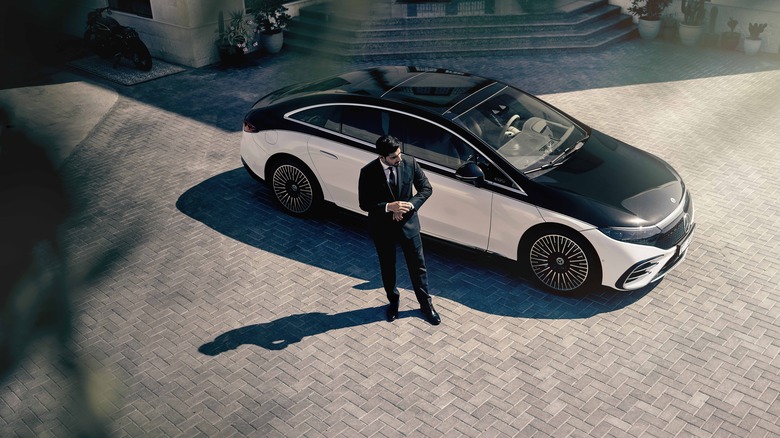 Man in suit by car