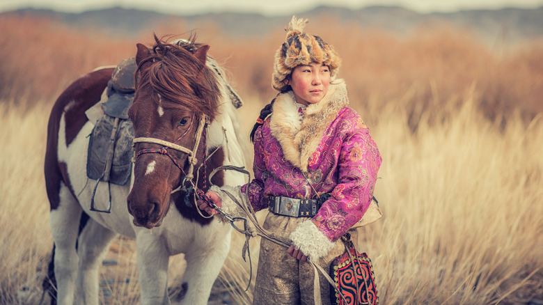 Nomadic girl and horse