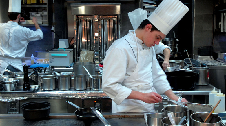 Chef cooks in restaurant kitchen