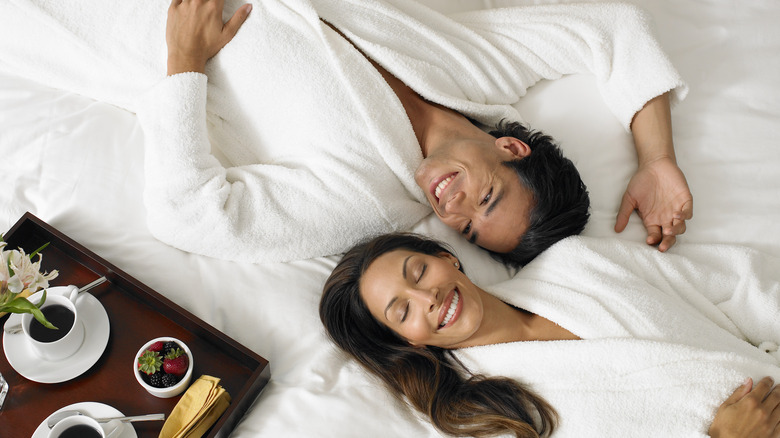 Couple on a hotel bed