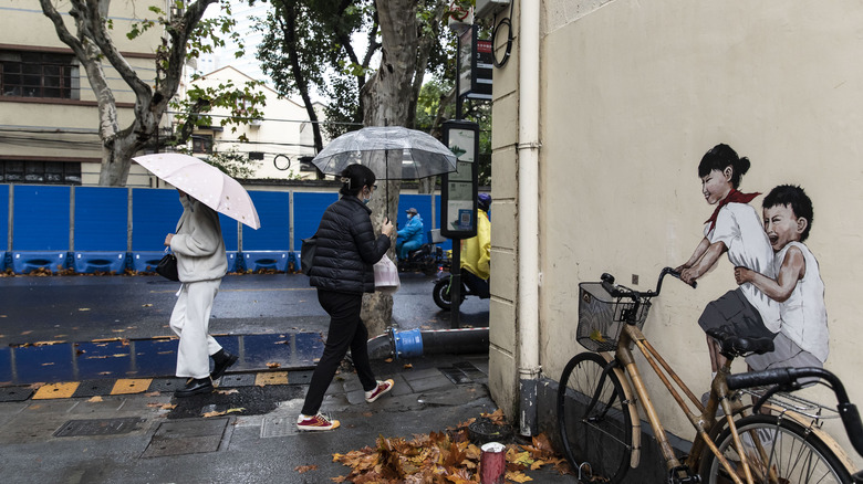 People walking in rain.