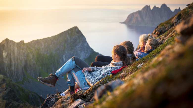 travelers on cliff edge