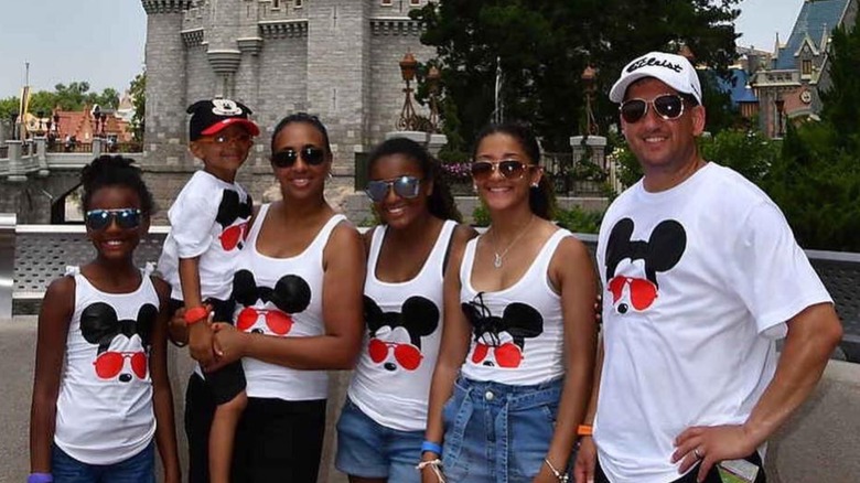 Family with matching Disney shirts