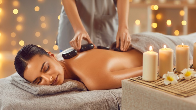 woman receiving hot stone massage