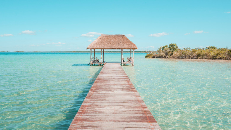 A walkway over blue waters of Riviera Maya