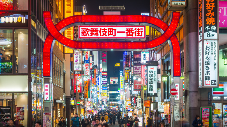 Neon lights on busy street.