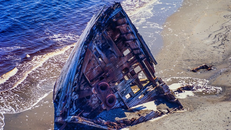 Part of shipwreck on a beach
