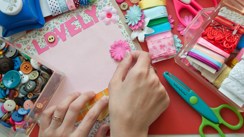 Woman's hands scrapbooking