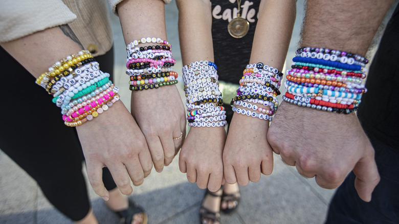 Fans' wrists covered in Taylor Swift friendship bracelets