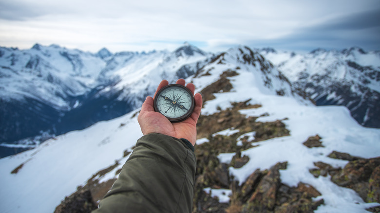 Compass being held up