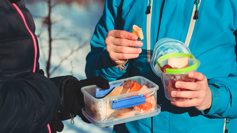 Hikers with snacks in tupperware