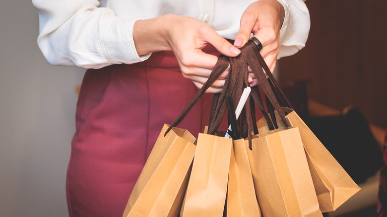 woman holding gift bags