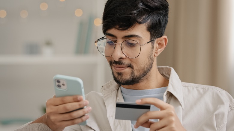 man buying tickets on phone