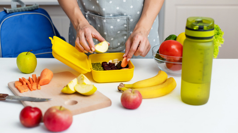 Woman packing healthy snacks