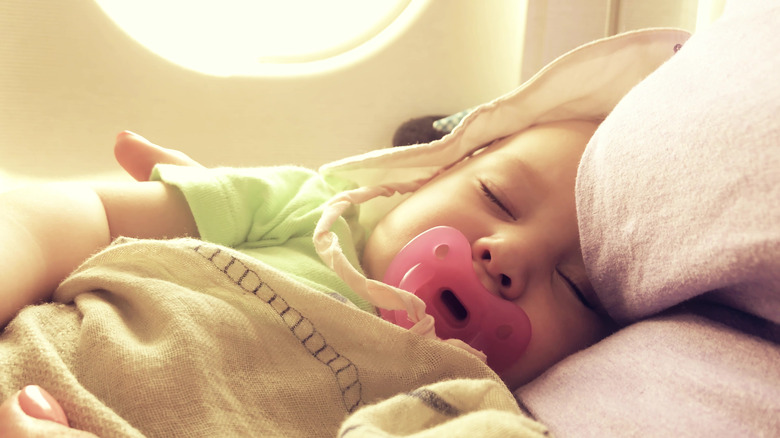 Sleeping baby with pacifier