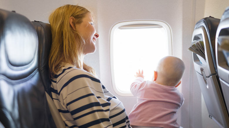 Mom with baby in airplane
