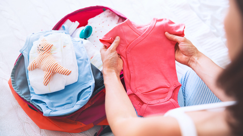 Woman packing baby things