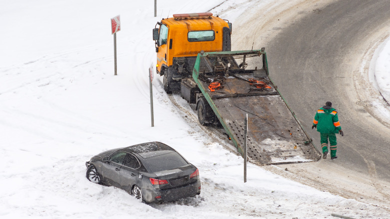 tow truck helping stuck car