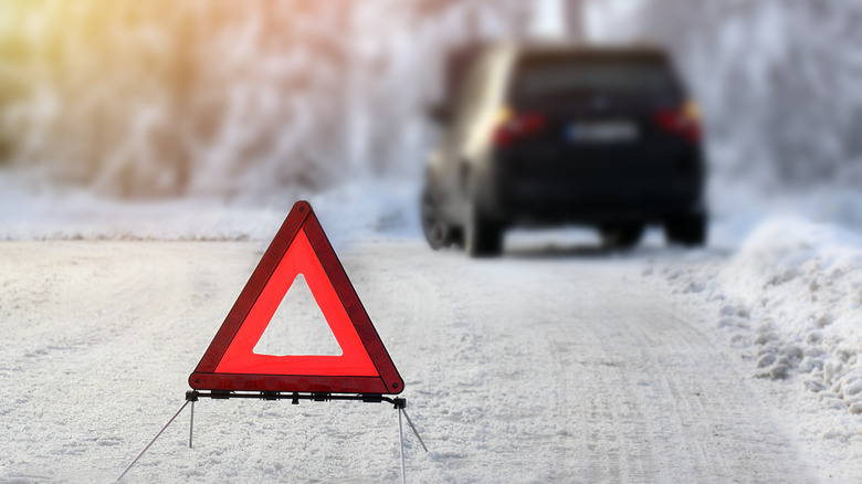 car in distress in snow