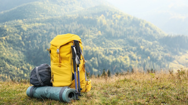 Backpacking gear on ground