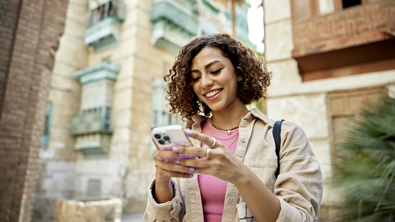 Woman on phone traveling