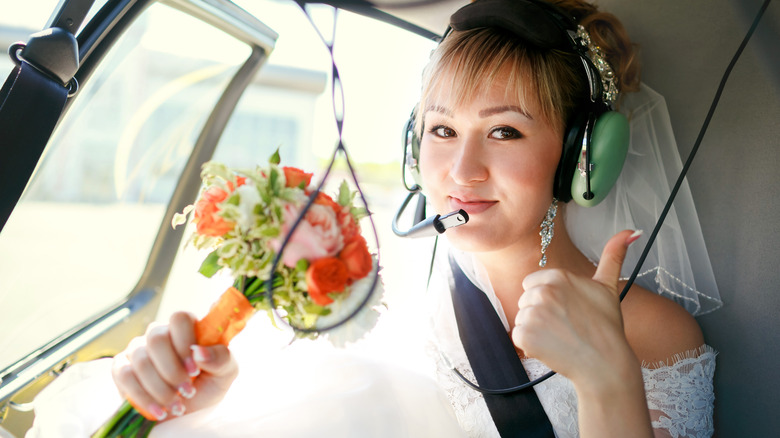 bride with flowers in helicopter