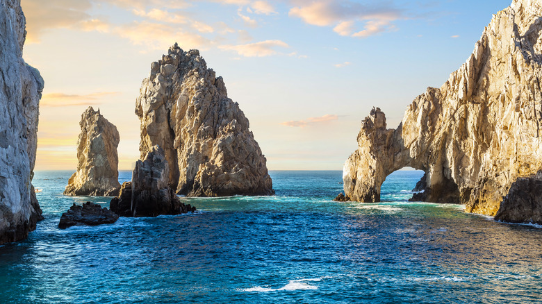 Arch rock formation in sea