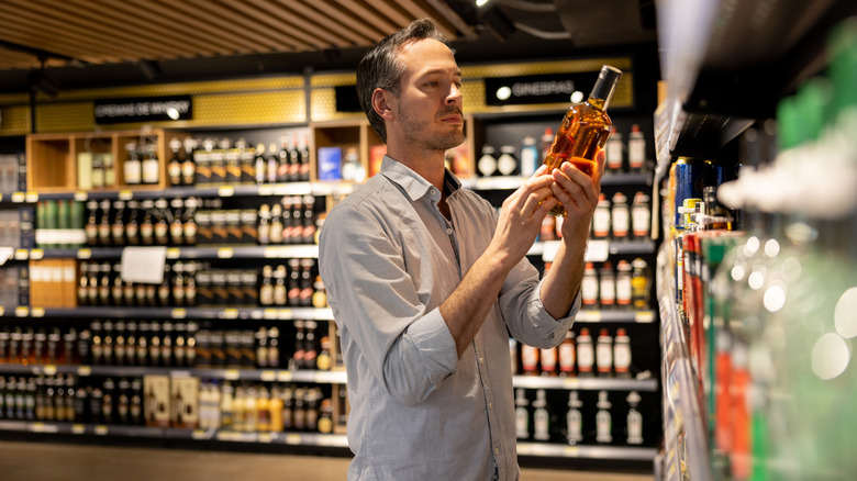 Man buying whiskey