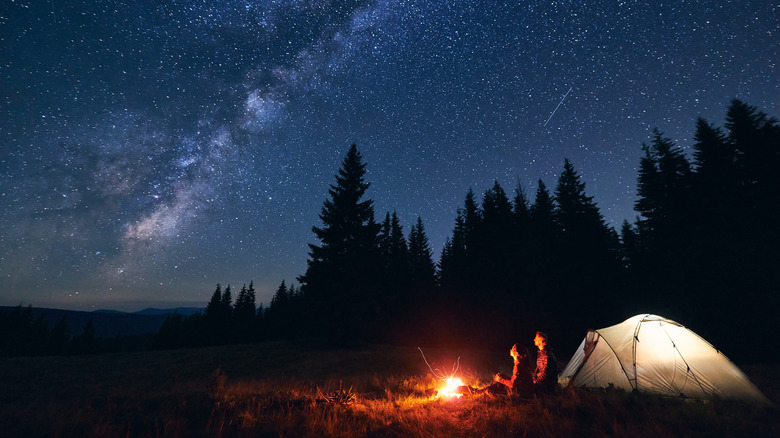 Camping under night sky