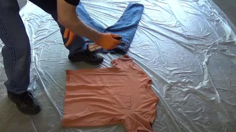 Man spraying clothing