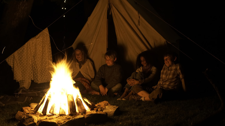 Campers enjoy a campfire
