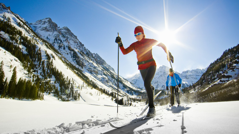 Two people cross-country skiing