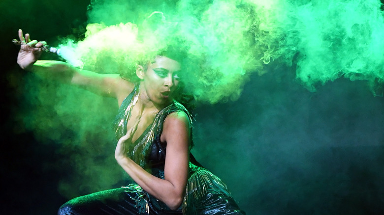 burlesque dancer with green smoke