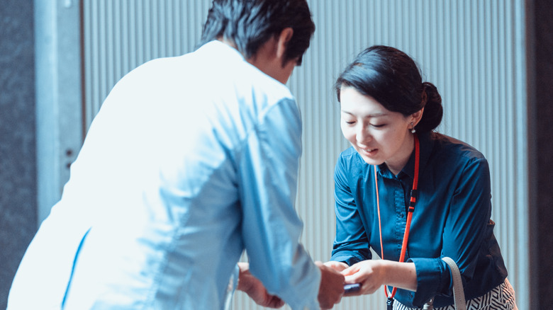 People exchanging business cards Japan