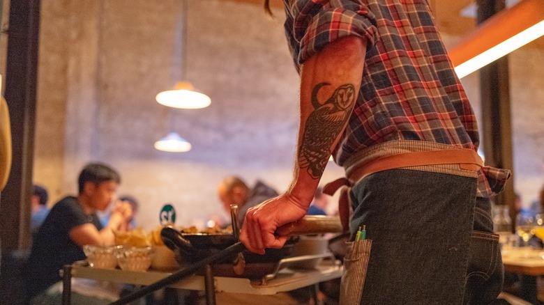 Serving food at State Bird Provisions
