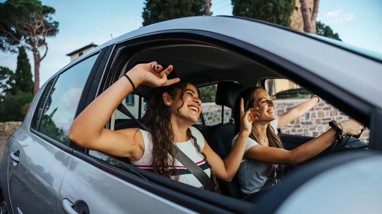 friends singing in car