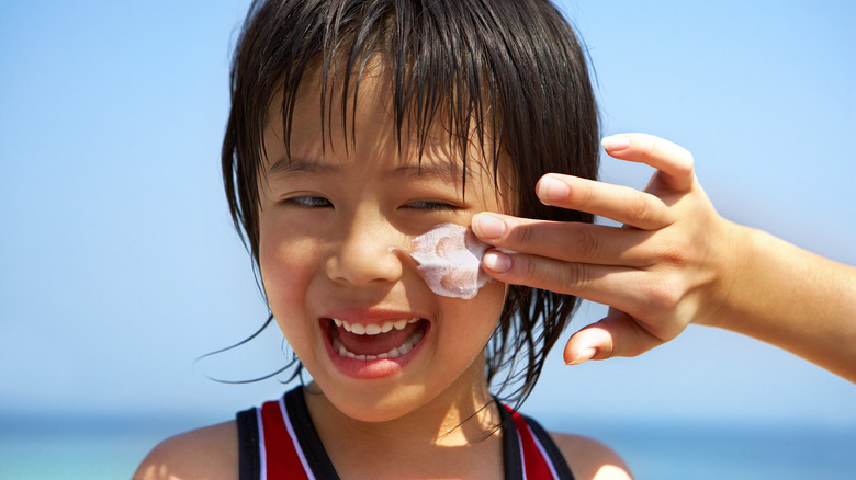 child wearing sunscreen
