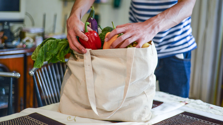groceries in reusable tote bag