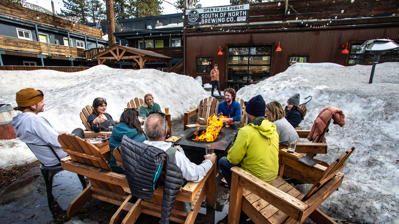 People gathered around fire pit