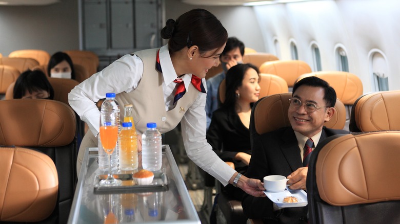 flight attendant with beverage cart