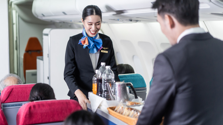 flight attendants with cart