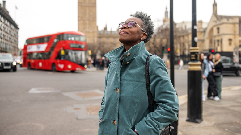 woman outside enjoying bus stop