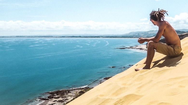 Louis Cole on a sand dune