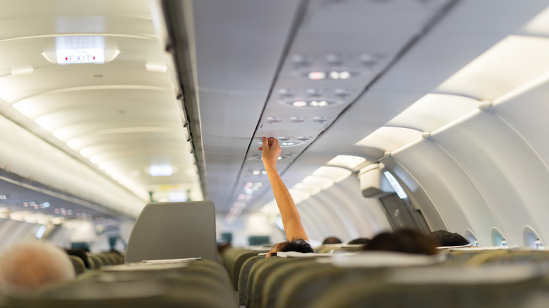 Passenger adjusts plane air-conditioning